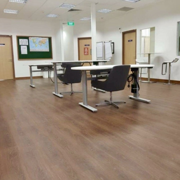 Luxury vinyl flooring SWC422SUM with a warm woodgrain finish from Sen Wall Coverings – stylish and durable for modern Singapore homes.